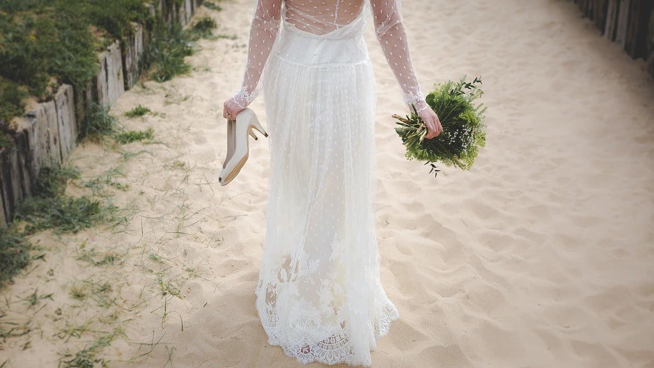 bride holding shoes