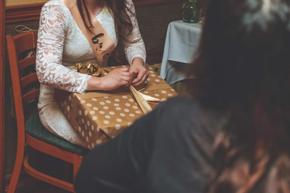 woman opening gift