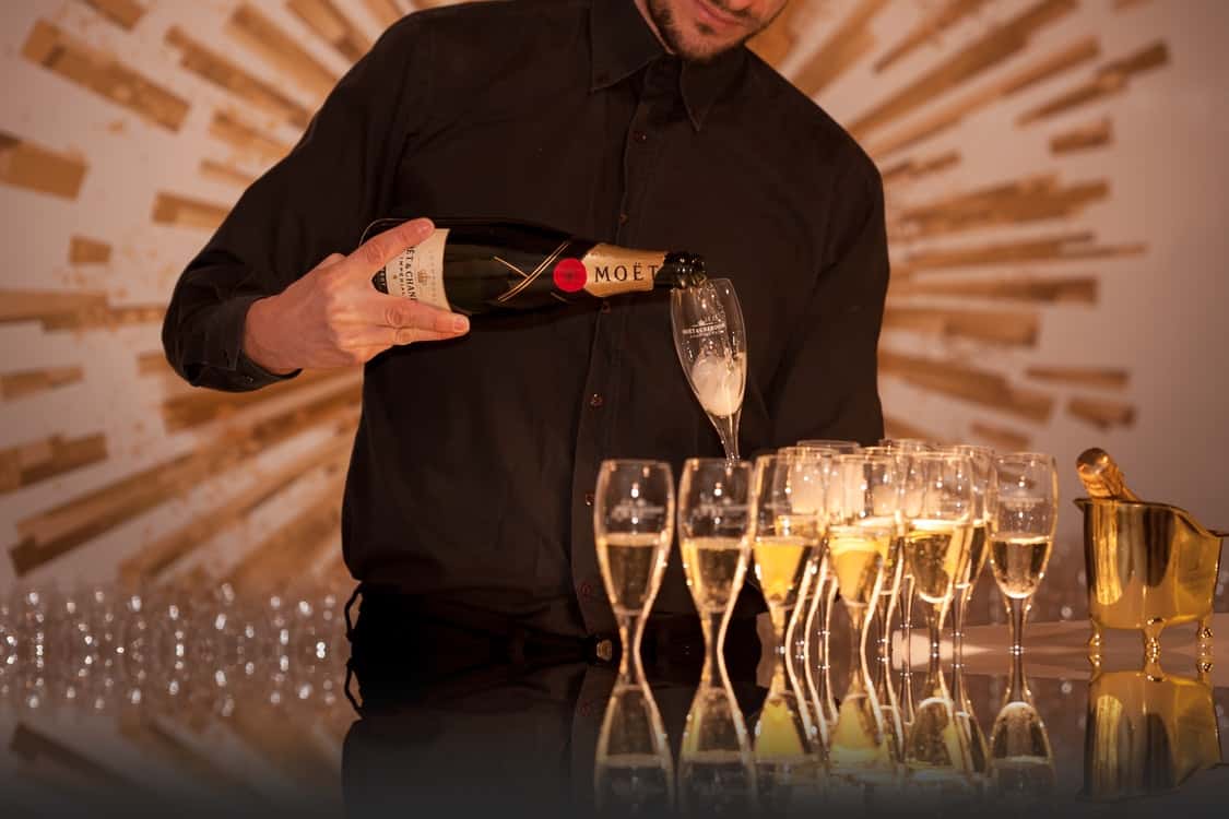man pouring champagne