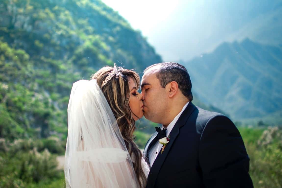 groom bride kiss
