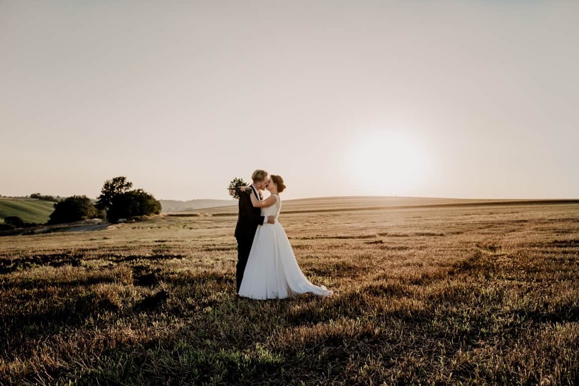 kissing groom bride