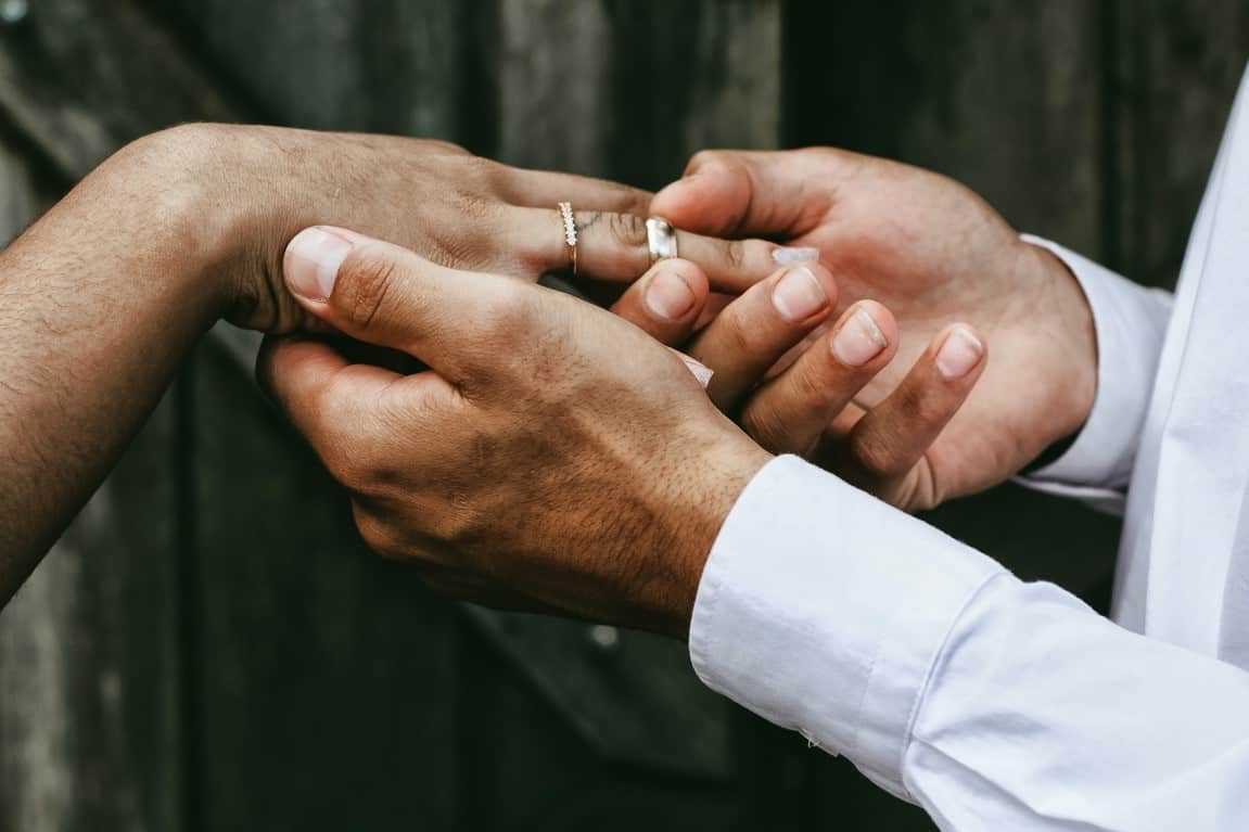 putting on engagement ring