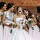 Cute bridesmaids and a bride are laughing