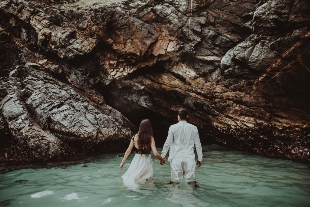 couple wearing formal clothes on a lake