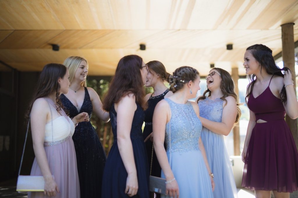 friends talking at a wedding