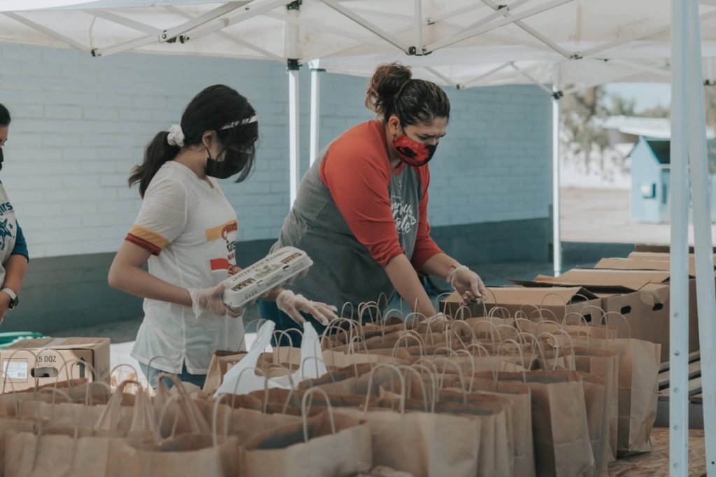 two woman volunteering