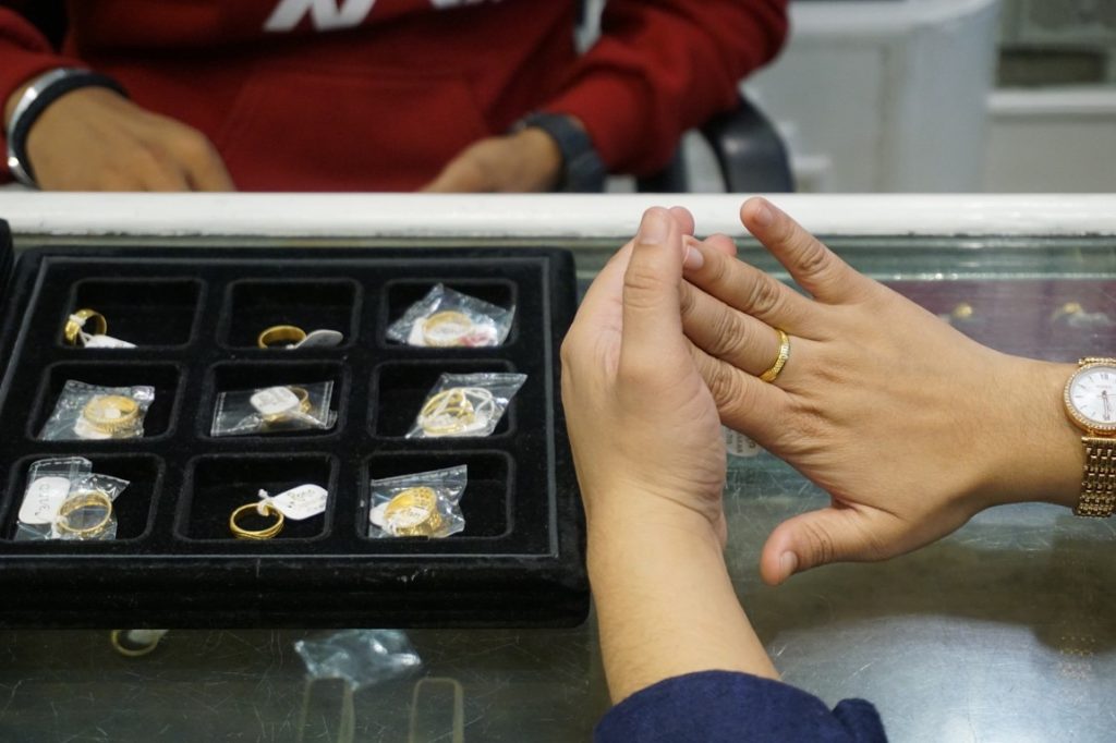 woman trying out a ring