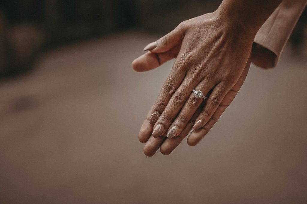 woman's hand with engagement ring