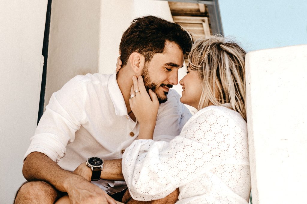 attractive couple going in for a kiss