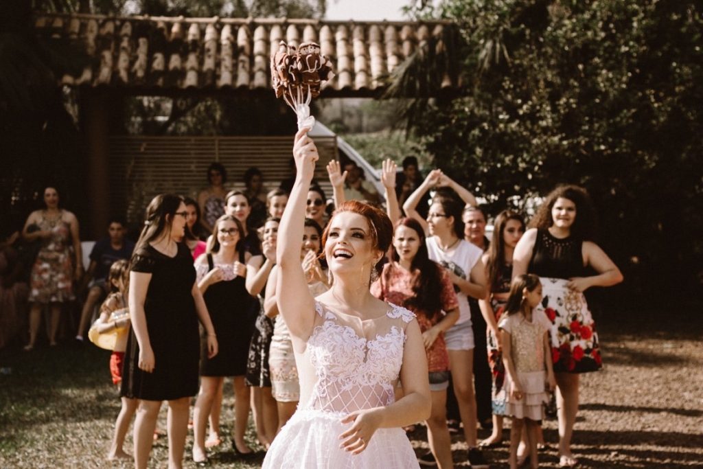 bride throwing bouquet