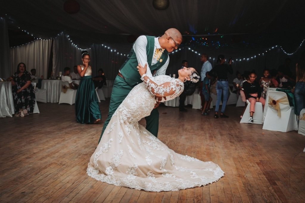 groom dipping his wife