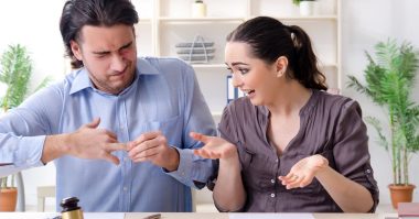 man having a hard time taking off his ring