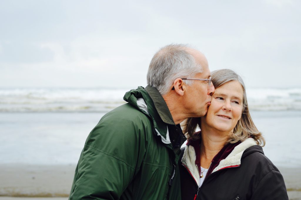 old man kissing his wife