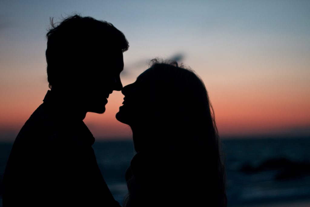 silhouette of couple nose to nose