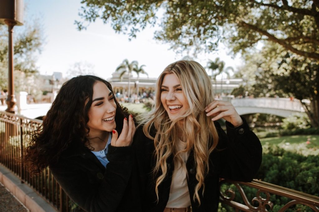 two woman laughing