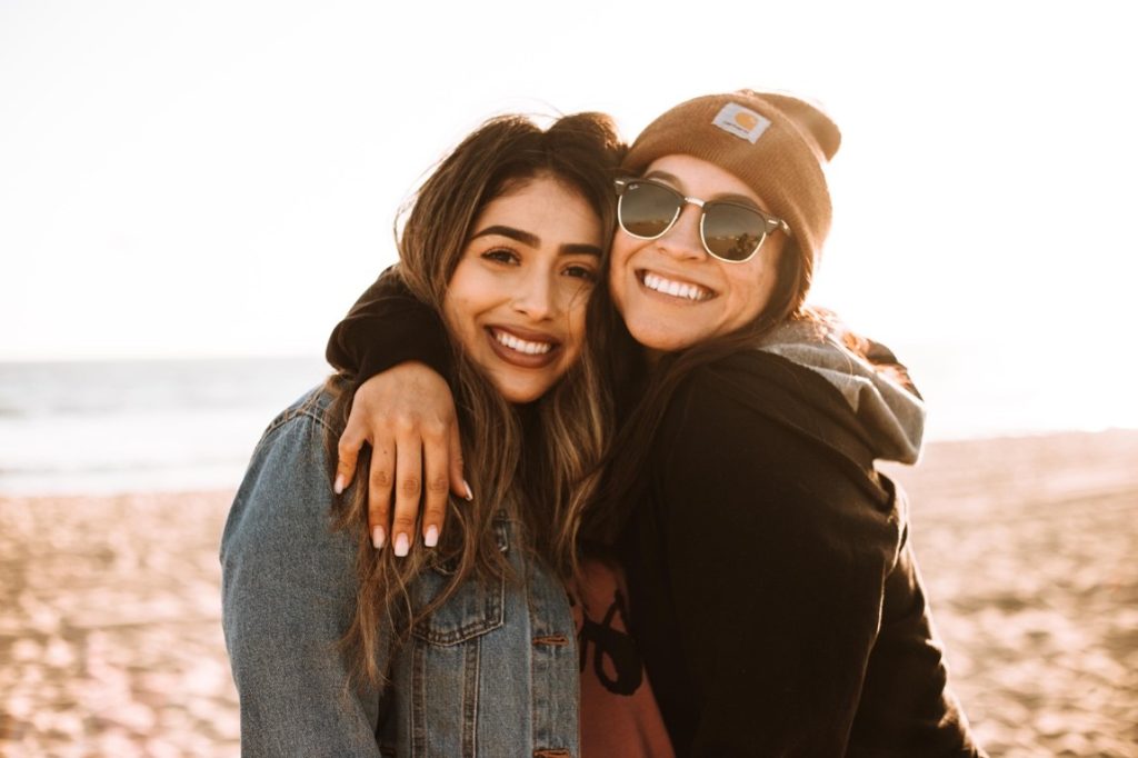 two woman smiling