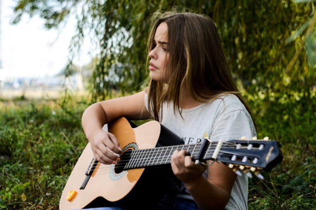 woman playing guitar