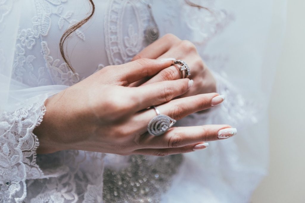 woman taking off her wedding ring