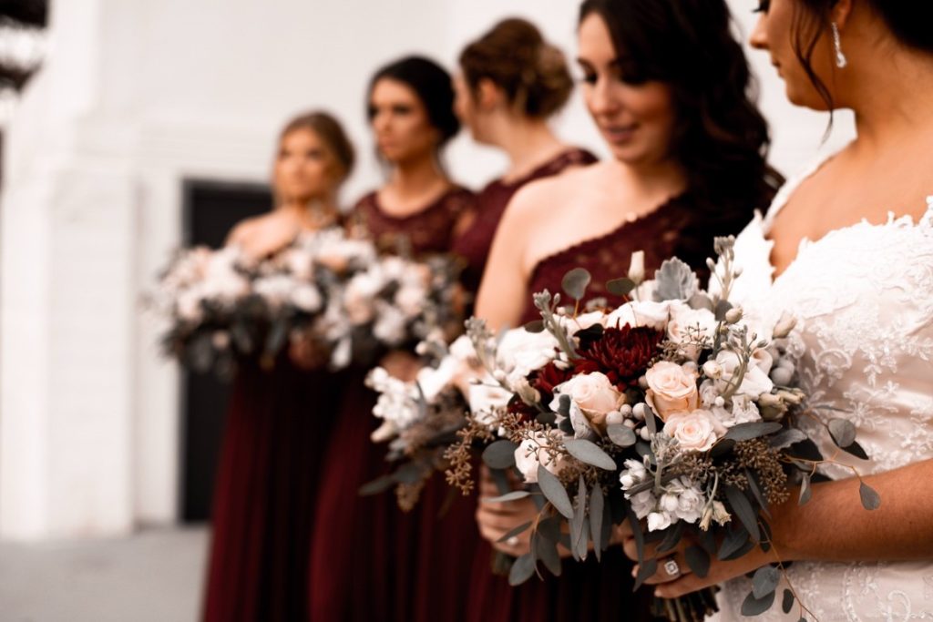 bride and her bridesmaids holding bouquet