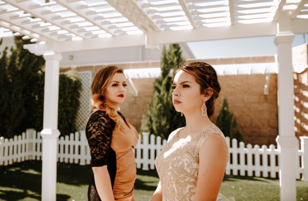 bride looking away while her mom is looking at her
