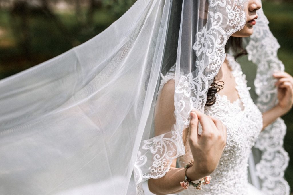 bride wearing embroidered veil