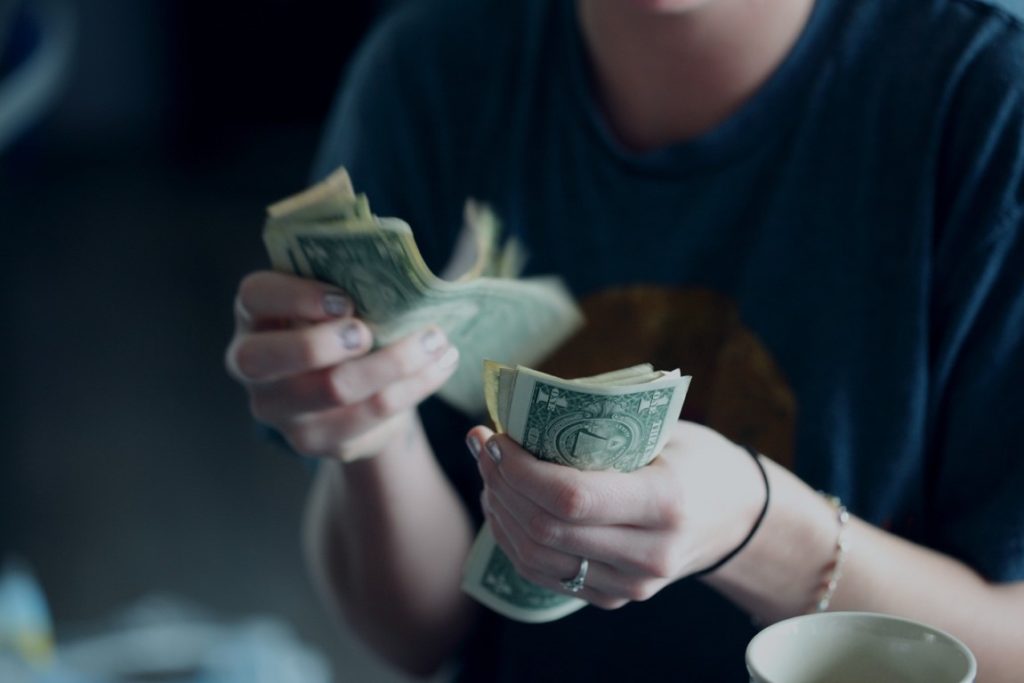 man counting money