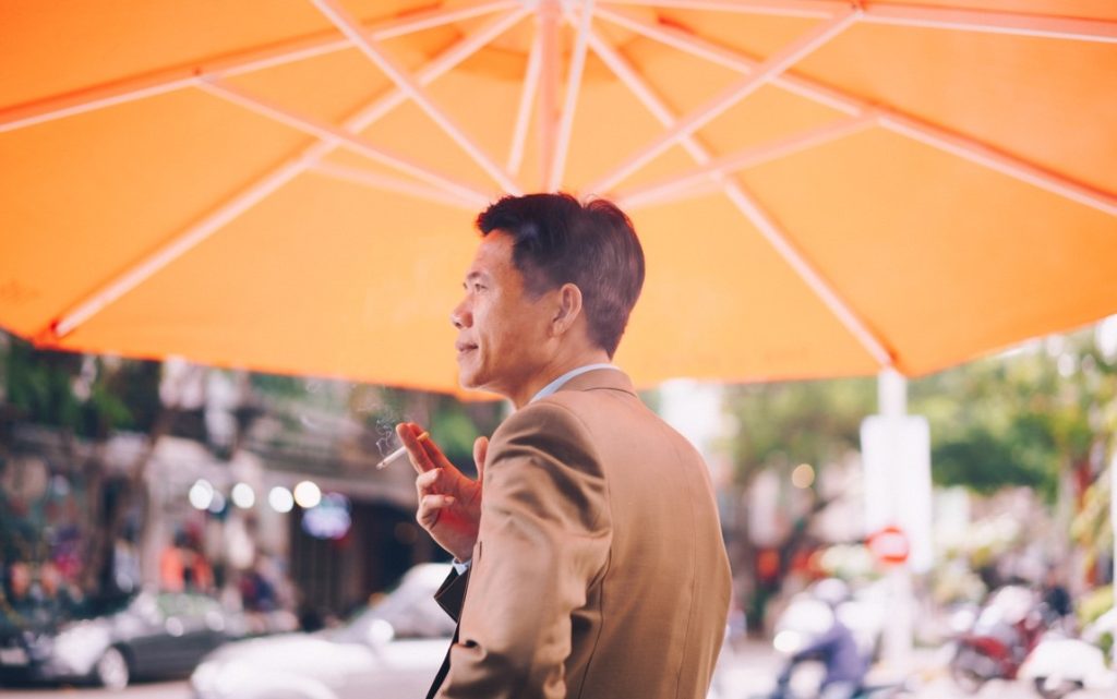 man wearing tux having a cigarette