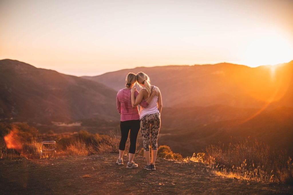 mother and daughter watching the sunset