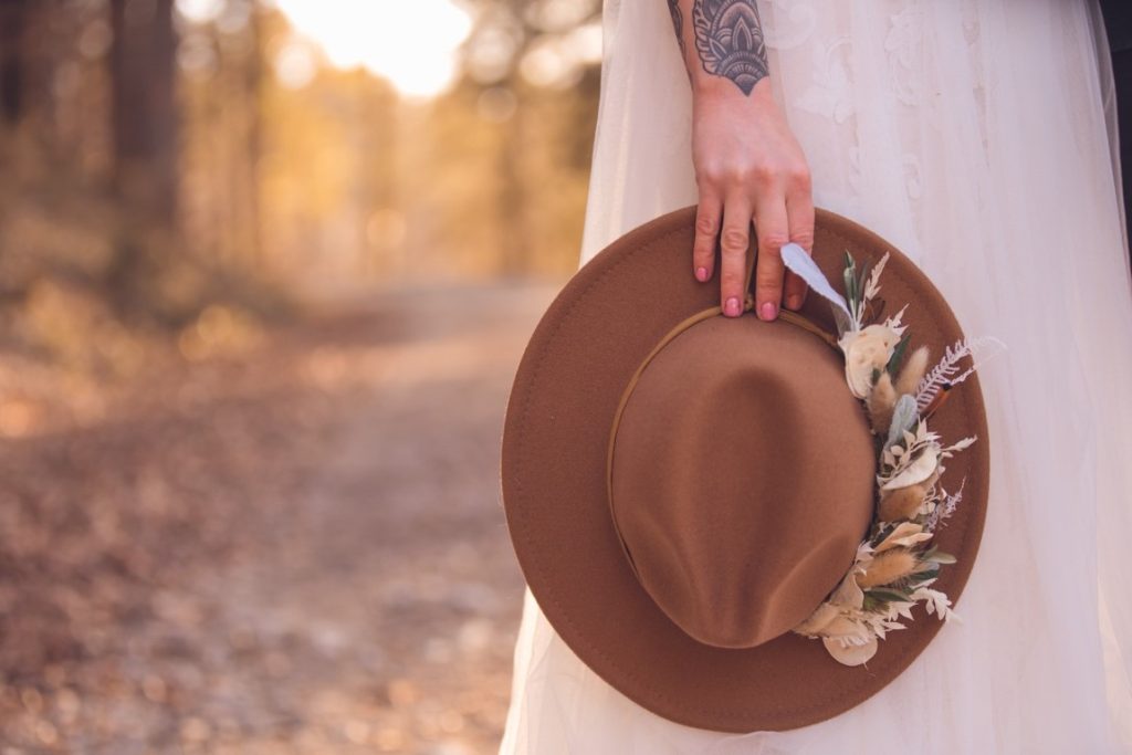 woman holding panama hat