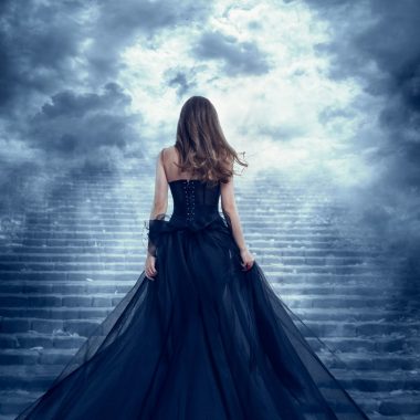 woman in a beautiful navy blue dress