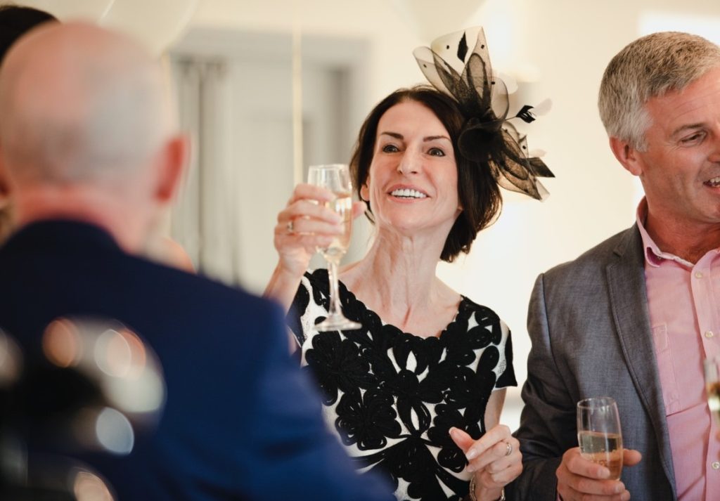 woman raising her glass