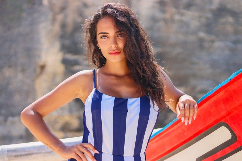 woman wearing blue and white stripes bikini