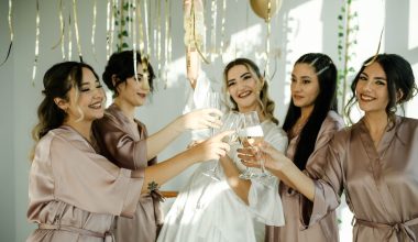 bride and friends drinking champagne