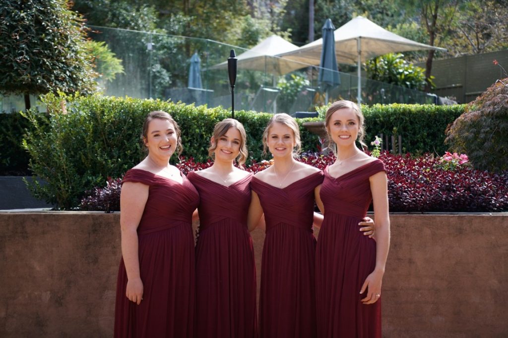 bridesmaid wearing burgundy dresses