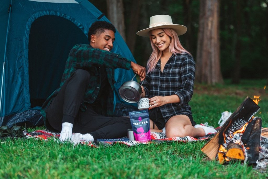 couple camping and drinking tea