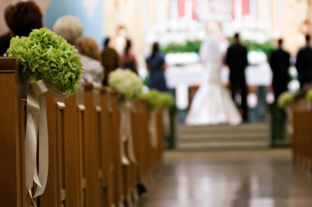 couple getting married in a church