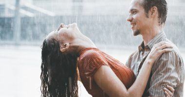 man and woman bathing in the rain