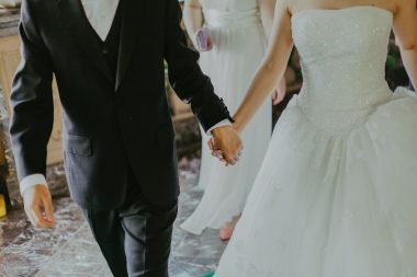 newlyweds holding hands