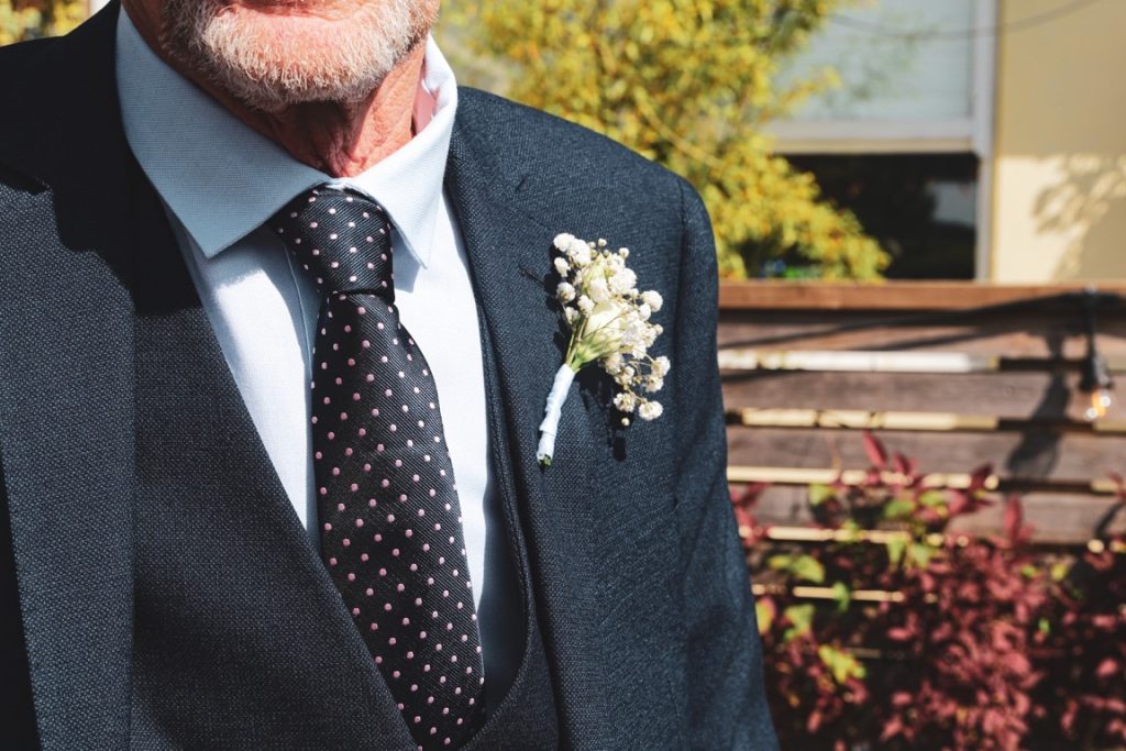 old man with baby's breath boutonniere
