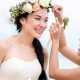 woman fixing flower crown of the bride