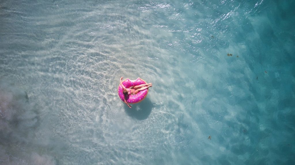 woman on a pink swim ring