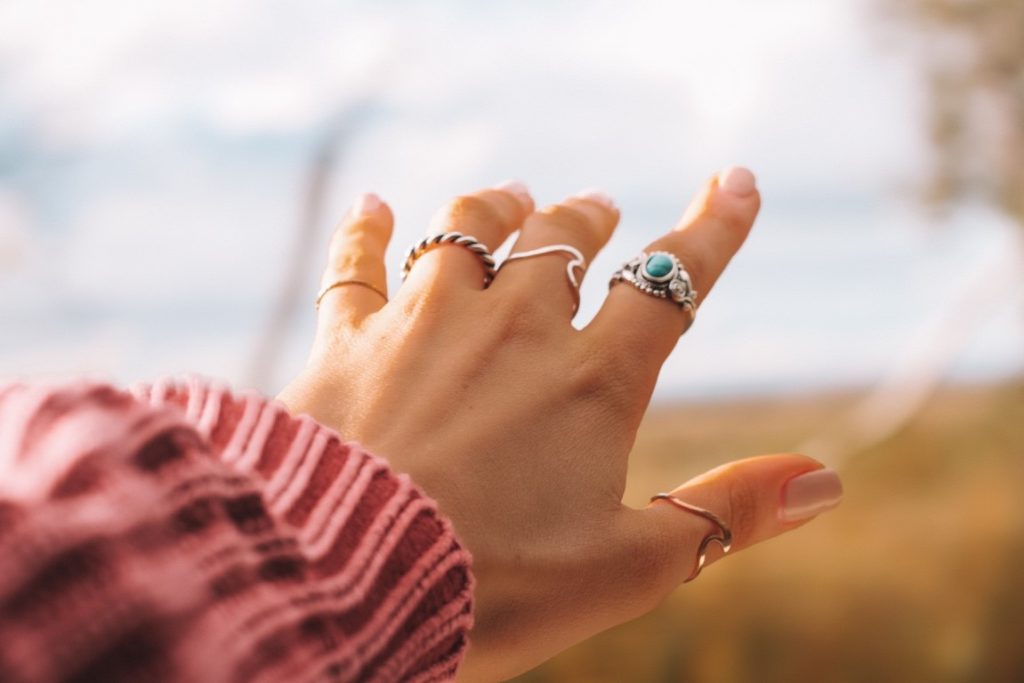 woman showing off her rings