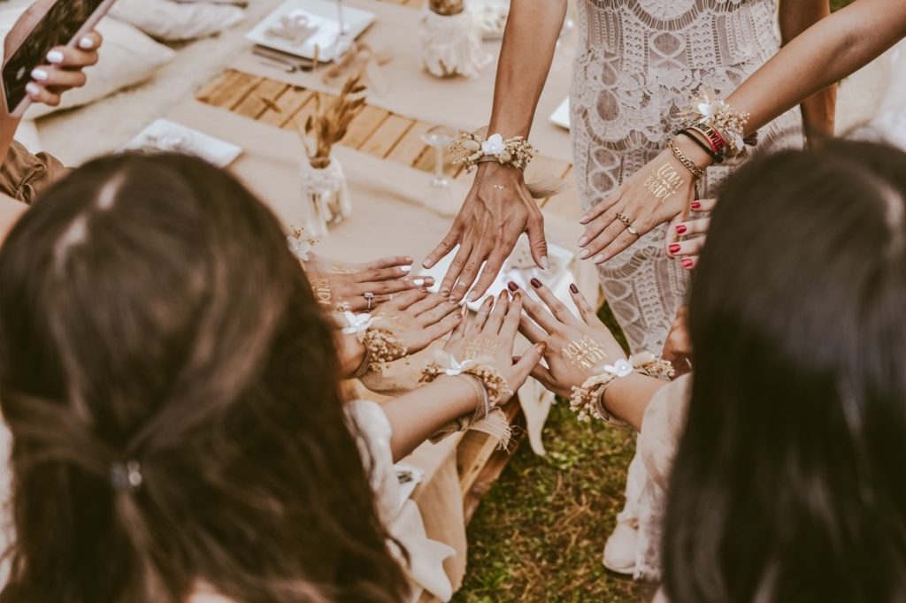 women playing to choose the honorary bridesmaid