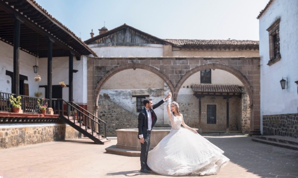 groom twirling bride