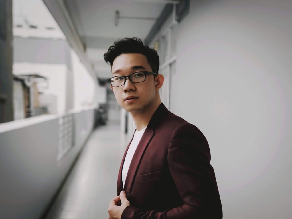 man wearing maroon blazer