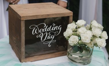 wedding box beside a bouquet of white flowers