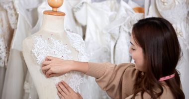 wedding dressmaker working on a mannequin