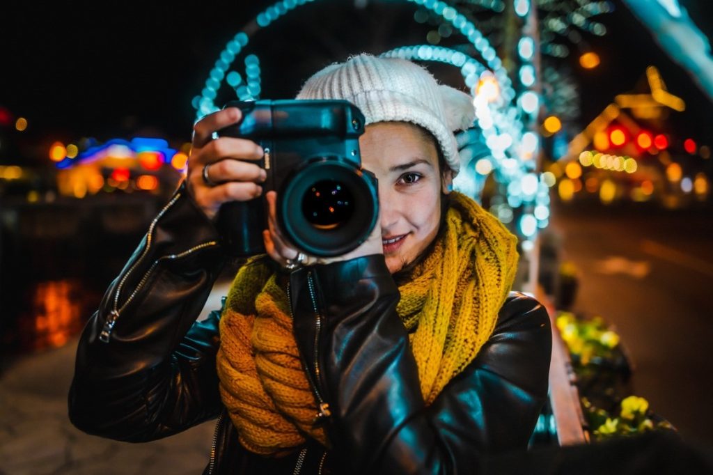 woman holding a camera