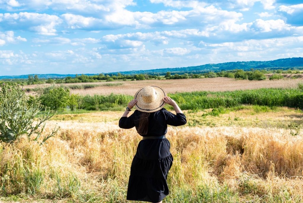 woman wearing a hat on a field