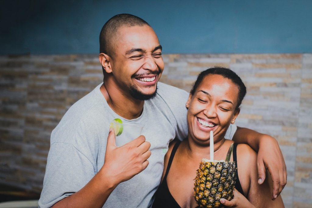 man and woman smiling